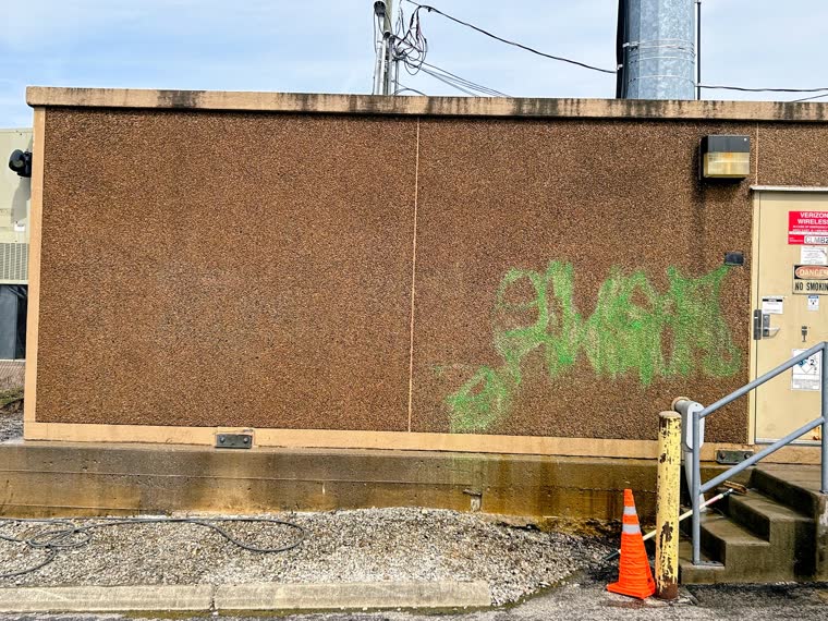 Graffiti removal progress photo