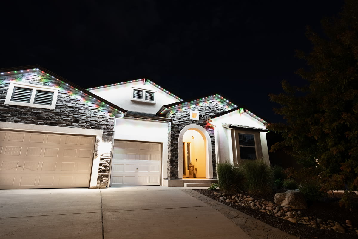 After photo showing permanent exterior lights installed on a home
