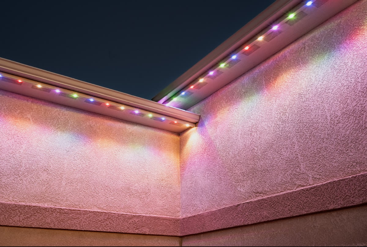 Close-up of permanent exterior lighting with multiple colors under the soffit