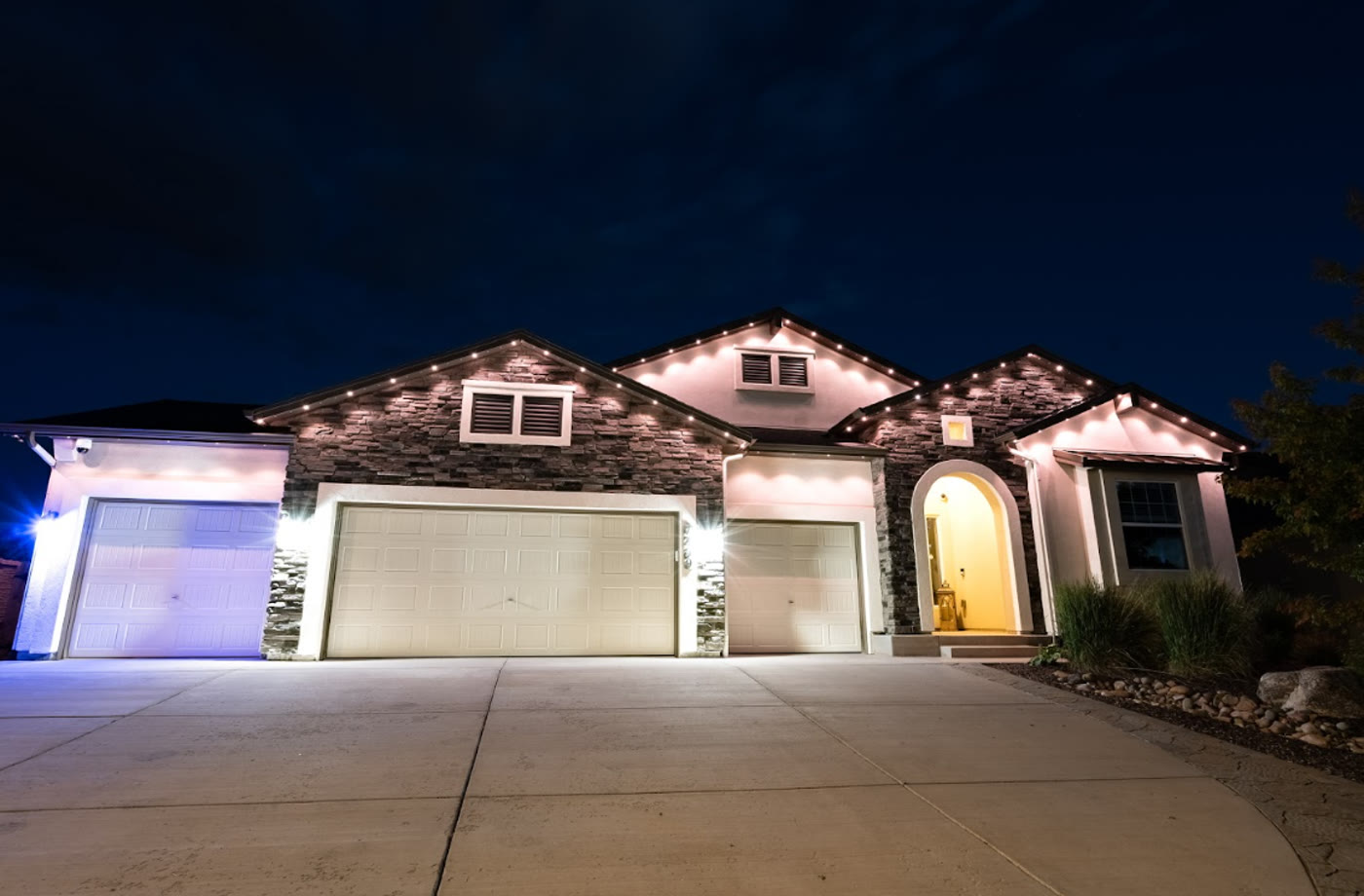 Home with clean white permanent exterior lighting